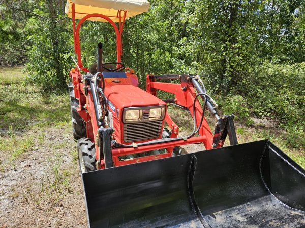 front view of red YM1720D tractor with scoop