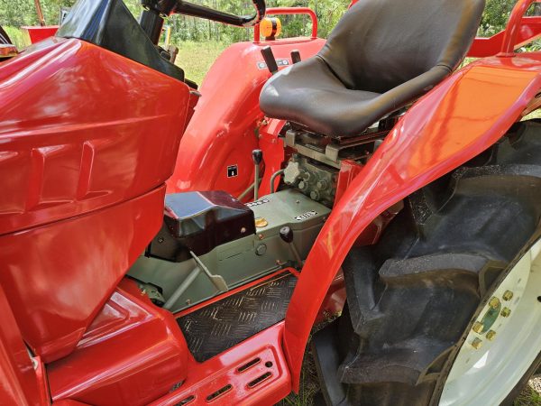 view of seat and steering of red YM1720D tractor